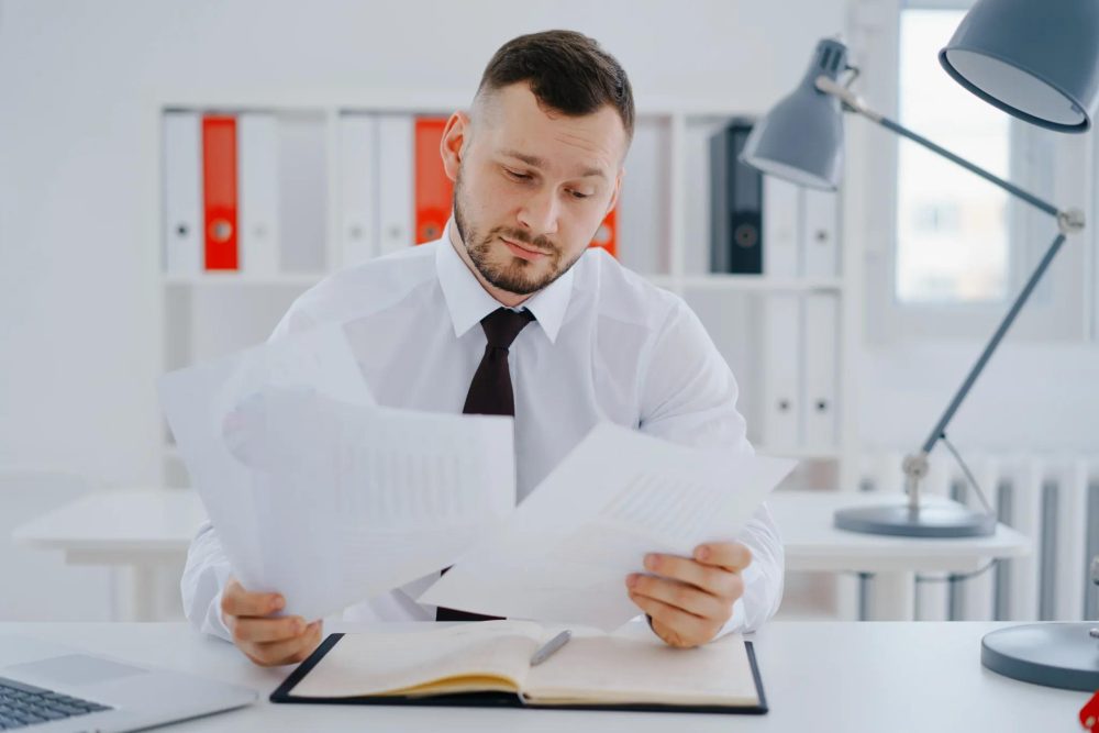 man checking forgery document