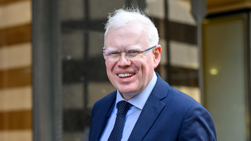 Sex offender MP Gareth Ward smiling happily