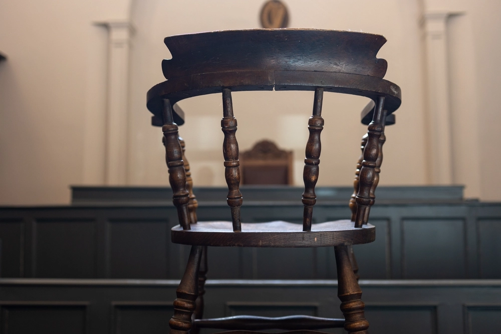 Accused chair in court. Hardwood chair in courtroom