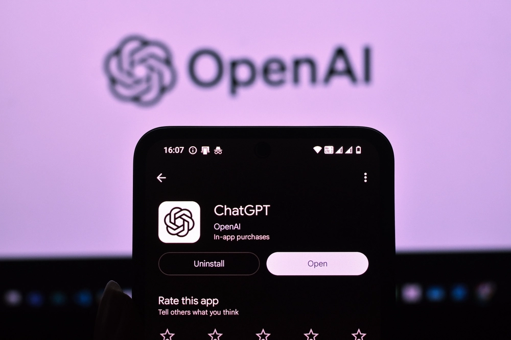 Smartphone displaying the ChatGPT app page on the Play Store, with the OpenAI logo.