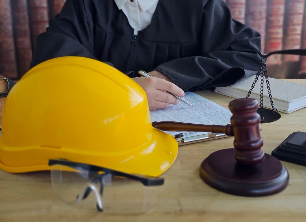 Judge hammer and helmet Law and Justice about labor law concept Construction law