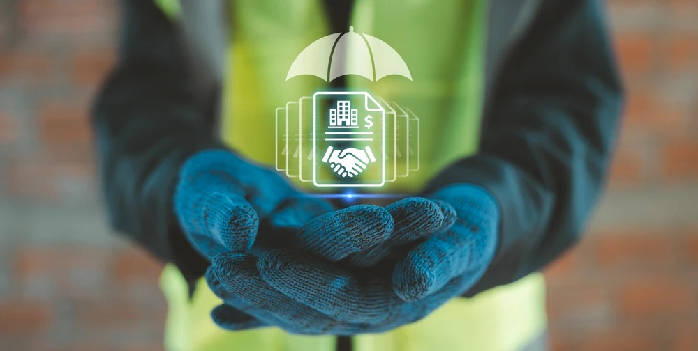 Construction industry insurance safety coverage hands holding holographic umbrella